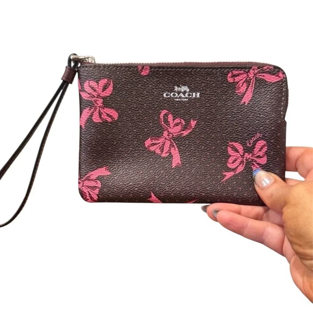 Coach Dark Brown Wristlet with Pink Bow Accents clutch designer purse